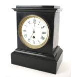 A Victorian slate mantel clock with Roman numerals denoting hours.