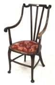 A Georgian style stained elbow chair.