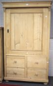 A 20th century stripped pine single door wardrobe.