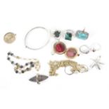 An assortment of jewellery including a silver bangle, silver rings, etc.