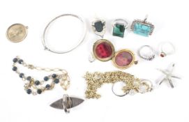 An assortment of jewellery including a silver bangle, silver rings, etc.