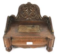 A late 19th century carved oak workbox.