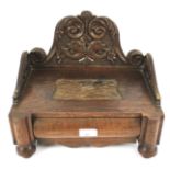 A late 19th century carved oak workbox.