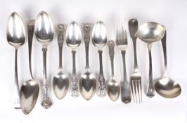 Twelve assorted pieces of silver flatware. Including ladles, forks, spoons, serving spoons etc.