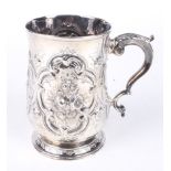 A silver embossed tankard.
