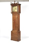 An 18th/19th century oak long case clock. with open swan neck pediment and ball finials.