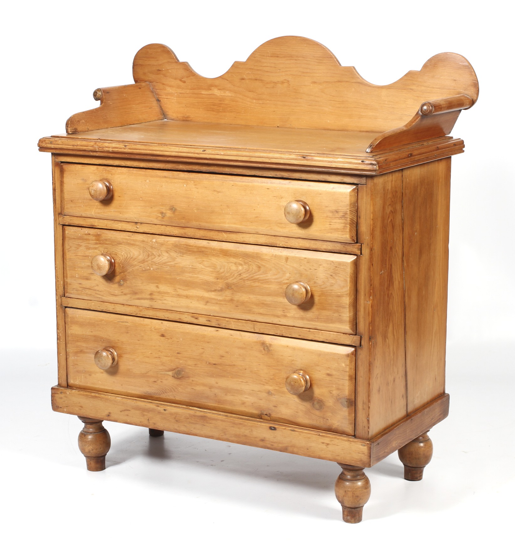 A 19th century pine chest of three graduating drawers.