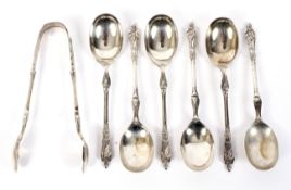 A set of six silver apostle spoons and matching tongs. Maker Atkins Brothers Sheffield 1911.