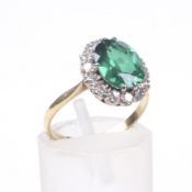 A mid-20th century gold, green synthetic-spinel and diamond oval cluster dress ring.