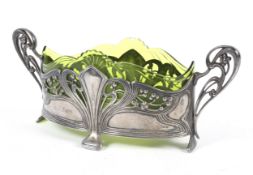 A WMF Art Nouveau two-handled oval centre dish with green glass liner.