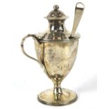 A Georgian silver mustard pot with later Georgian ladle. Of regency form raised on a pedestal base.
