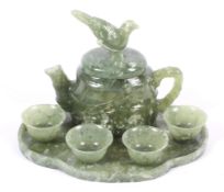 An Asian carved jadeite miniature tea set.