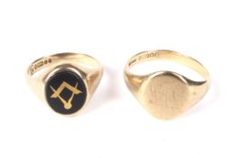 A vintage 9ct gold and black onyx 'masonic' signet ring and another signet ring.