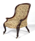 A Victorian mahognay framed spoon button back elbow chair.