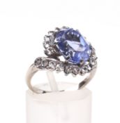 A synthetic-sapphire cross-over cluster ring.