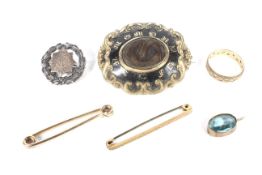 A collection of Victorian and later jewellery including a gold-plated shaped-oval mourning brooch