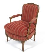 A contemporary continental style fruitwood framed elbow chair.