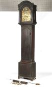 An 18th century oak grandfather clock with arched hood with blind fretwork decoration The dial with