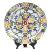 An 18th century Dutch Delft polychrome charger.
