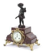 A French red marble and gilt-metal mounted mantle clock.