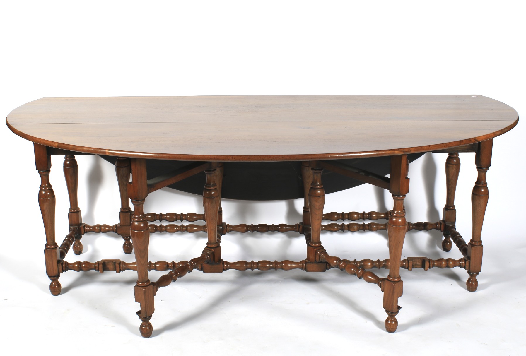 A 20th century elm wake drop leaf table and chairs.