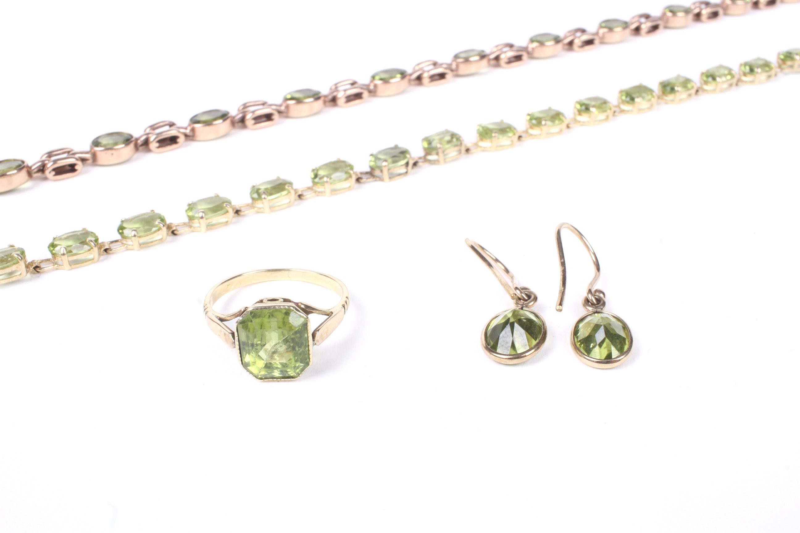 A peridot single stone ring, together with a pair of earrings, a bracelet and a necklace. - Image 2 of 3