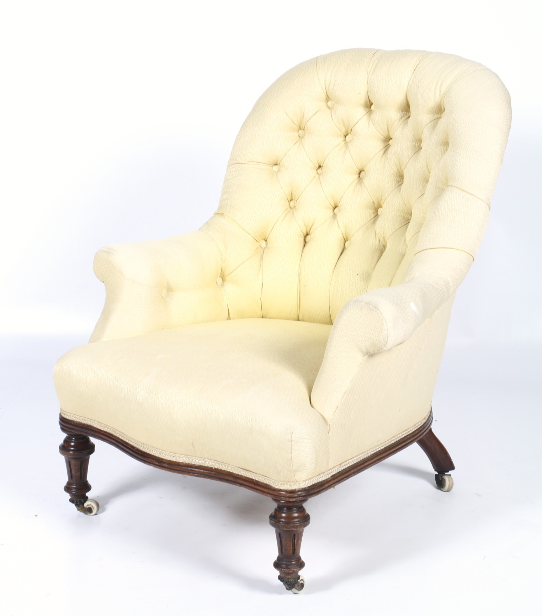 A Victorian walnut framed button back nursing chair. Re-upholstered in a zig zag material.