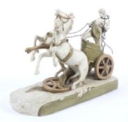 A large Royal Dux classical figure group. A youth riding a chariot, circa 1900.