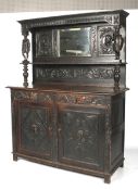 A 19th century oak Jacobean style mirrored backed sideboard.