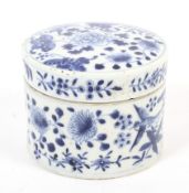 A 19th century Chinese porcelain blue and white cylindrical pot and cover.