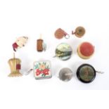 A collection of Victorian and later novelty tape measure.