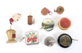 A collection of Victorian and later novelty tape measure.