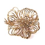 A vintage Continental 9ct gold stylised flower-head brooch.