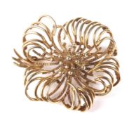 A vintage Continental 9ct gold stylised flower-head brooch.