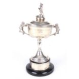 A mid century silver lidded twin handled golfing trophy.
