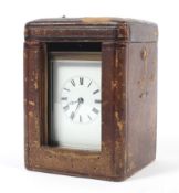 An early 20th century French brass repeater carriage clock fitted in leather case.