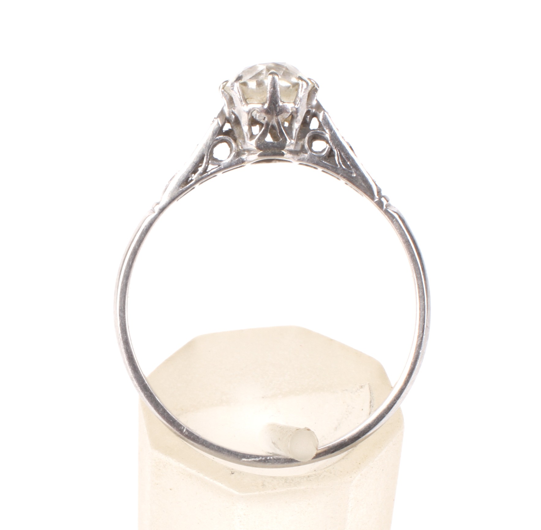 An early-mid 20th century platinum and diamond solitaire ring with small diamond shoulders. - Image 3 of 3