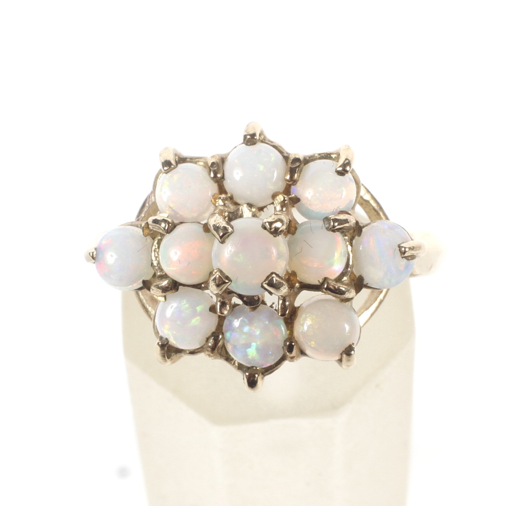 A 9ct gold hallmarked opal cluster ring. Set with eleven opals in three rows, Weight 2. - Image 2 of 4