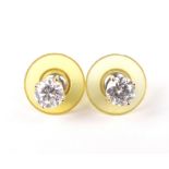 A pair of 18ct gold and diamond solitaire stud earrings. The round brilliants each approx. 0.