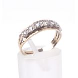 A vintage 9ct gold and cubic zirconia seven stone half-eternity ring.