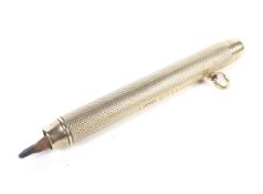 An early 20th century 9ct gold propelling pencil.