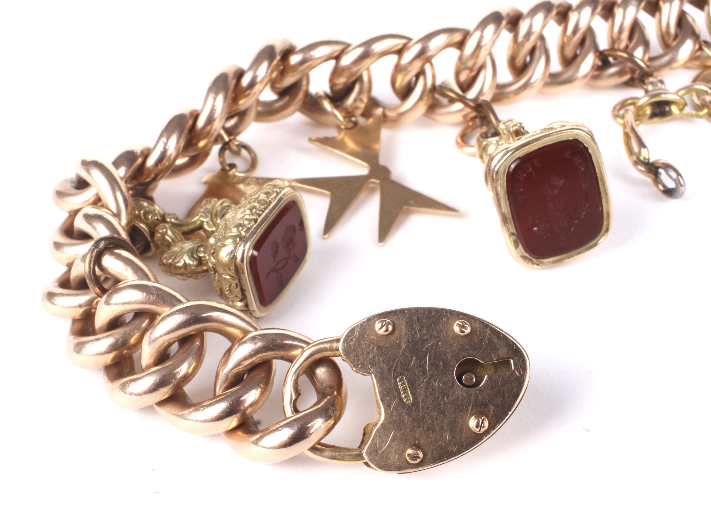 An early 20th century rose gold curb link 'charm' bracelet. - Image 2 of 2