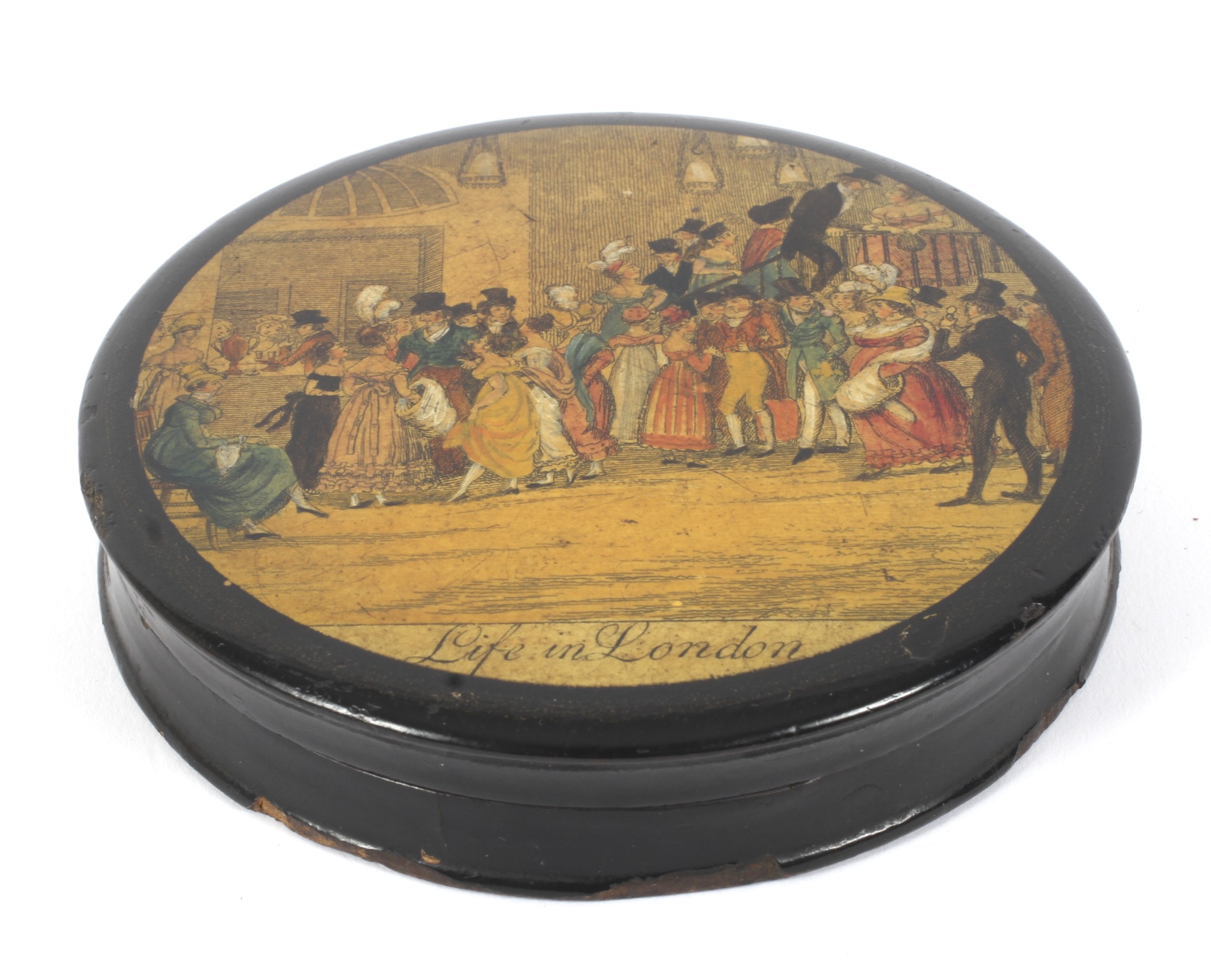 A 19th century lacquered papier mache circular snuff box.