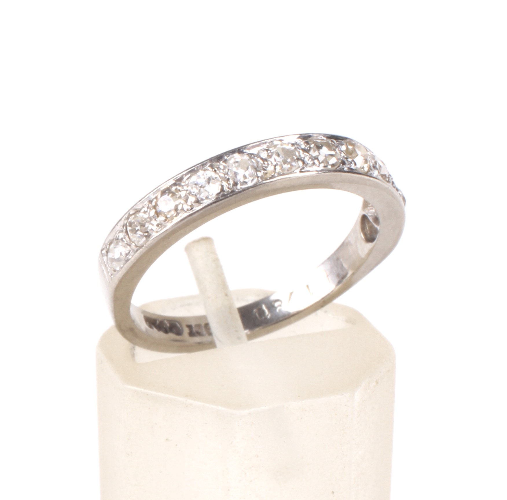 A mid 20th century gold and diamond half-eternity ring.