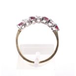 A vintage 18ct gold, ruby and diamond seven stone ring.
