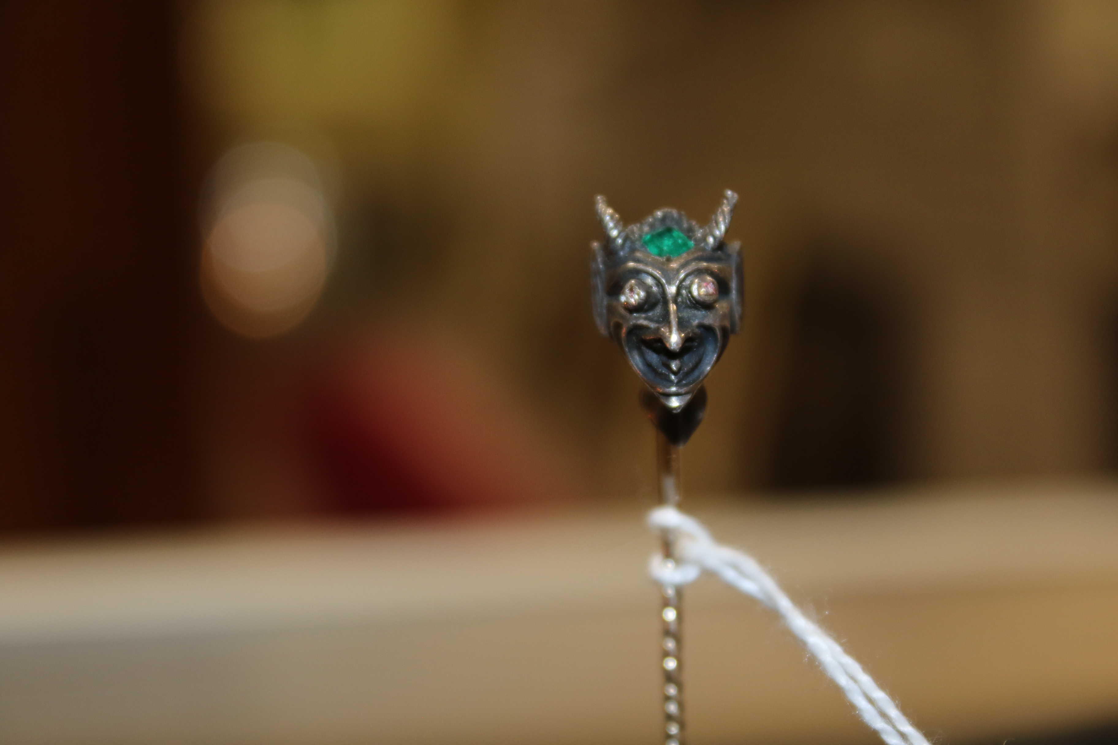 An early 20th century emerald and diamond 'devil's head' stick pin. - Image 3 of 6