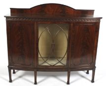 A late 19th century mahogany bow fronted display cabinet.