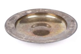 A silver dish with inscription.