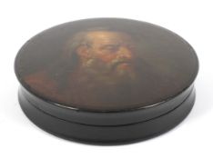 A Stobwasser type lacquered papier mache circular snuff box.