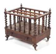 A Victorian burr walnut Canterbury With four corner finials raised on barley twist spindles above a